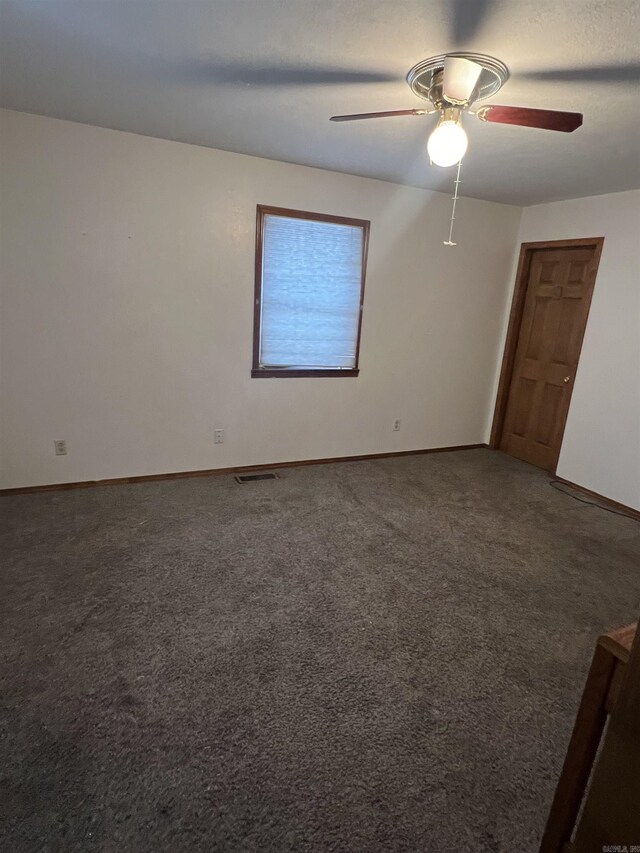 240 Round Up Ln, Mountain Home, AR 72653 - spare room with a ceiling fan, baseboards, and carpet floors