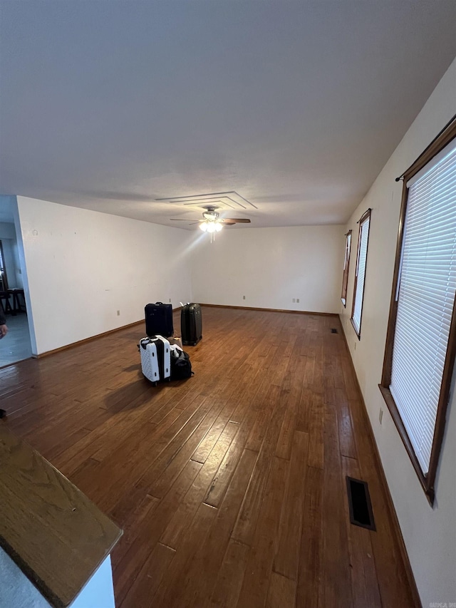 240 Round Up Ln, Mountain Home, AR 72653 - unfurnished living room with wood-type flooring, ceiling fan, and baseboards