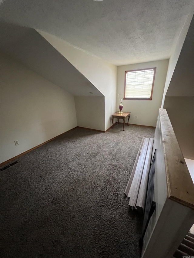 240 Round Up Ln, Mountain Home, AR 72653 - additional living space with carpet, a textured ceiling, and baseboards