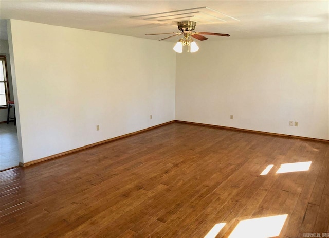 240 Round Up Ln, Mountain Home, AR 72653 - spare room with wood finished floors, baseboards, and a ceiling fan