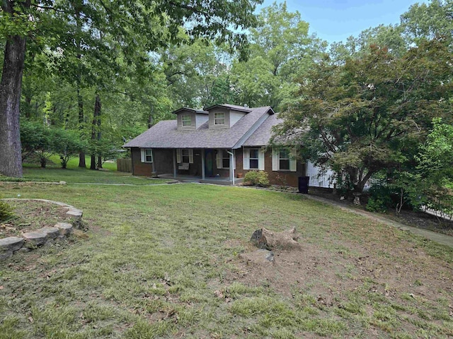 240 Round Up Ln, Mountain Home, AR 72653 - view of front of home featuring a front lawn, a shingled roof, a porch, and brick siding