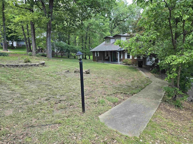 240 Round Up Ln, Mountain Home, AR 72653 - view of green lawn with a porch