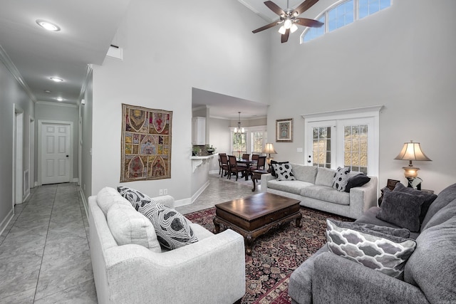 406 Parliament St, Little Rock, AR 72211 - living area featuring ornamental molding, baseboards, a ceiling fan, a high ceiling, and a chandelier