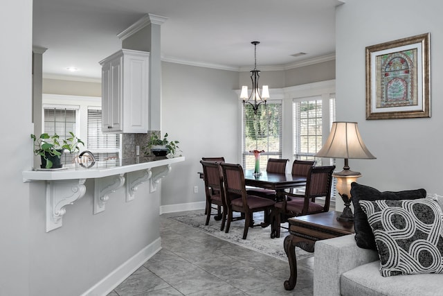 406 Parliament St, Little Rock, AR 72211 - dining room featuring baseboards and crown molding