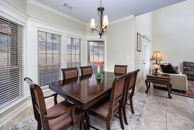406 Parliament St, Little Rock, AR 72211 - dining room with crown molding, a chandelier, and baseboards