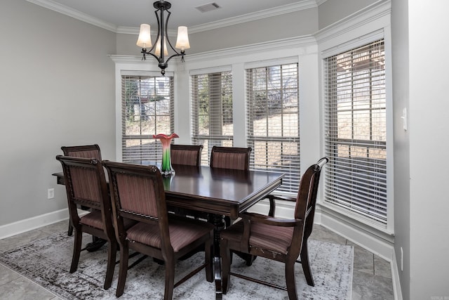 406 Parliament St, Little Rock, AR 72211 - dining space featuring a chandelier, crown molding, and baseboards