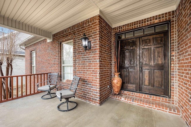 406 Parliament St, Little Rock, AR 72211 - view of exterior entry featuring a porch and brick siding