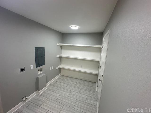 706 Scott St, Sheridan, AR 72150 - clothes washing area featuring hookup for an electric dryer, electric panel, hookup for a washing machine, and baseboards