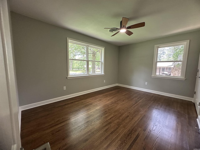 706 Scott St, Sheridan, AR 72150 - empty room featuring ceiling fan, dark wood-type flooring, and baseboards
