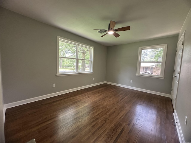 706 Scott St, Sheridan, AR 72150 - spare room with ceiling fan, dark wood-type flooring, and baseboards