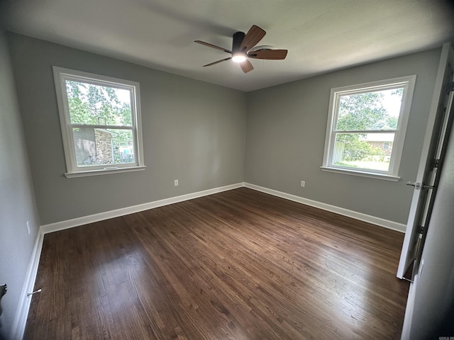 706 Scott St, Sheridan, AR 72150 - spare room featuring plenty of natural light, a ceiling fan, dark wood finished floors, and baseboards