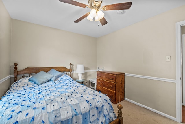 bedroom with carpet flooring, baseboards, and ceiling fan