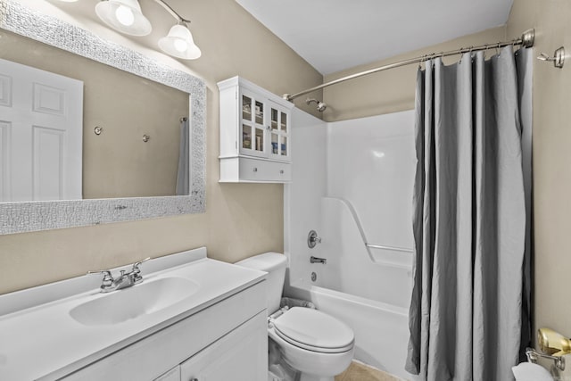 bathroom with shower / bath combo, vanity, and toilet