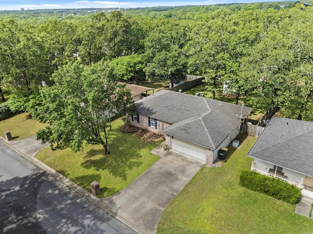 view of subject property featuring a heavily wooded area