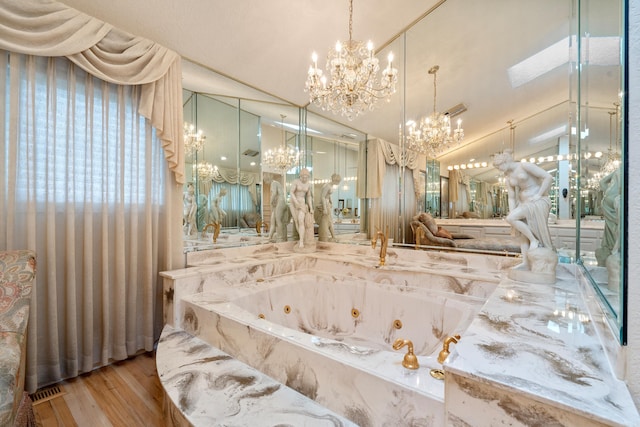 5000 Central Ave Unit 26-27, Hot Springs, AR 71913 - bathroom with a chandelier, wood finished floors, and a whirlpool tub