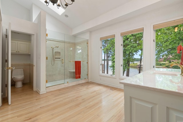 5000 Central Ave Unit 26-27, Hot Springs, AR 71913 - full bathroom with a stall shower, toilet, a water view, wood finished floors, and vaulted ceiling