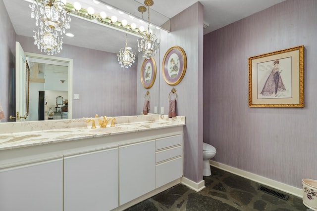 5000 Central Ave Unit 26-27, Hot Springs, AR 71913 - bathroom featuring a chandelier, baseboards, toilet, and vanity