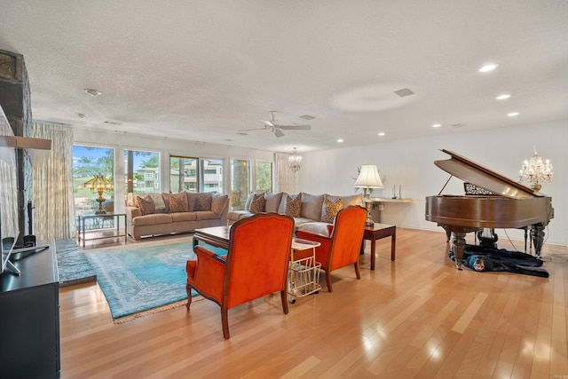 5000 Central Ave Unit 26-27, Hot Springs, AR 71913 - living room featuring wood finished floors, a chandelier, recessed lighting, a ceiling fan, and a textured ceiling