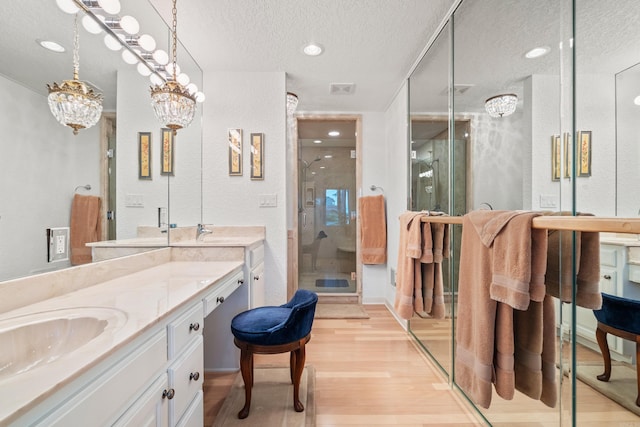 5000 Central Ave Unit 26-27, Hot Springs, AR 71913 - bathroom featuring a textured ceiling, wood finished floors, a shower stall, vanity, and recessed lighting