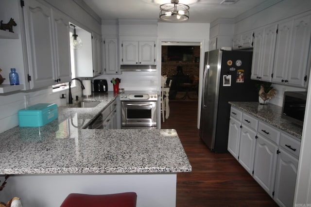 1108 N 14th St, Nashville, AR 71852 - kitchen featuring appliances with stainless steel finishes, a sink, dark wood-style floors, white cabinetry, and under cabinet range hood