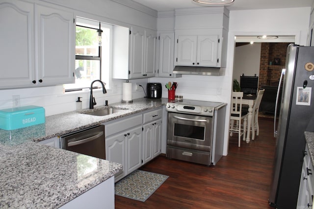 1108 N 14th St, Nashville, AR 71852 - kitchen with appliances with stainless steel finishes, a sink, white cabinetry, dark wood-style floors, and crown molding