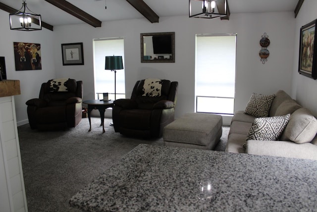1108 N 14th St, Nashville, AR 71852 - living area featuring a chandelier, beam ceiling, and carpet flooring