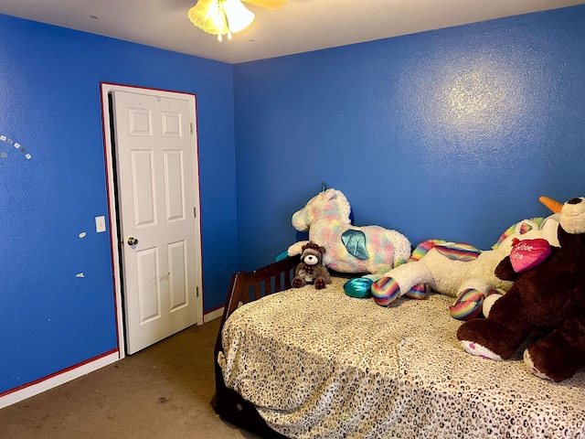 carpeted bedroom featuring baseboards