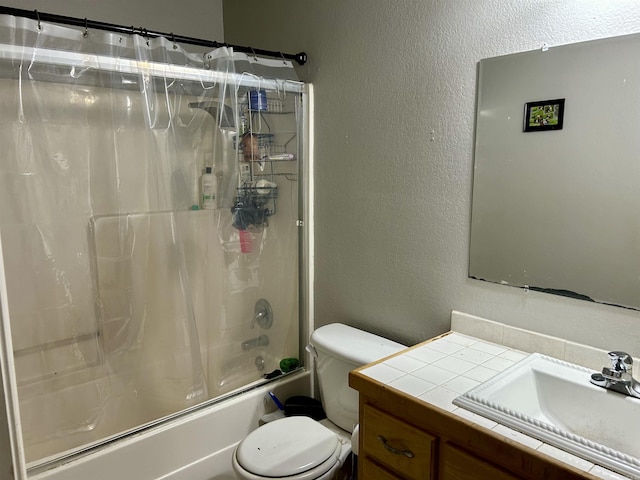 full bath featuring vanity, shower / bath combination with curtain, toilet, and a textured wall