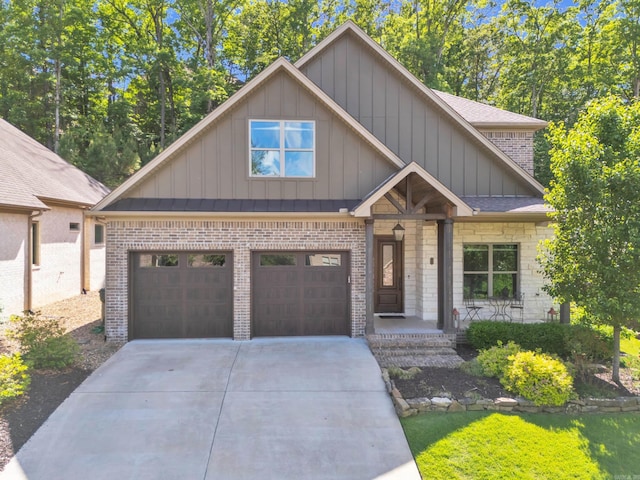 17 Cove Creek Pt, Little Rock, AR 72211 - craftsman-style house featuring board and batten siding, driveway, brick siding, and a shingled roof
