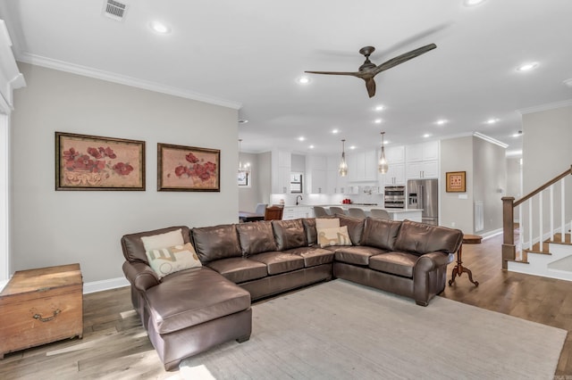 17 Cove Creek Pt, Little Rock, AR 72211 - living area featuring ceiling fan, ornamental molding, stairway, light wood-style flooring, and recessed lighting