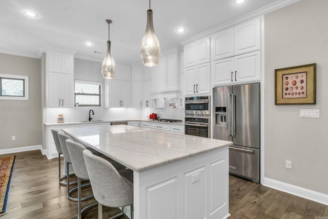 17 Cove Creek Pt, Little Rock, AR 72211 - kitchen featuring stainless steel appliances, baseboards, tasteful backsplash, white cabinets, and recessed lighting