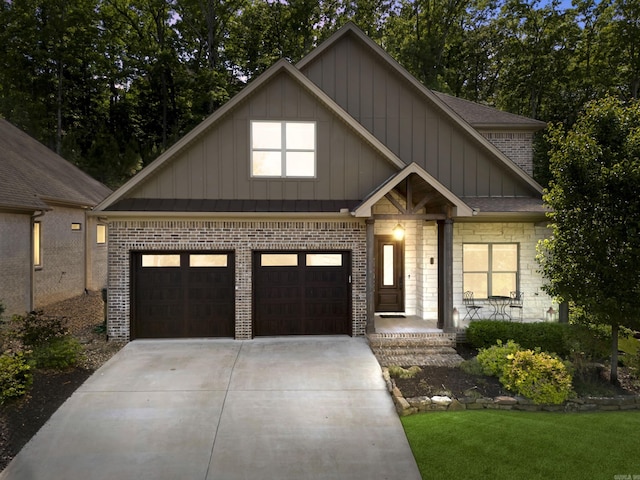 17 Cove Creek Pt, Little Rock, AR 72211 - craftsman-style house featuring board and batten siding, driveway, a garage, and brick siding