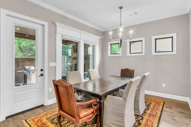17 Cove Creek Pt, Little Rock, AR 72211 - dining room featuring ornamental molding, light wood-style floors, a chandelier, and baseboards