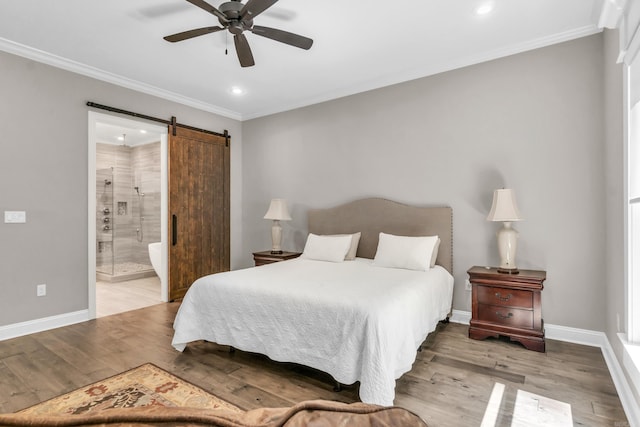 17 Cove Creek Pt, Little Rock, AR 72211 - bedroom with a barn door, recessed lighting, ornamental molding, baseboards, and wood finished floors