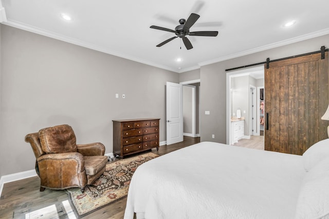 17 Cove Creek Pt, Little Rock, AR 72211 - bedroom featuring light wood finished floors, a barn door, crown molding, baseboards, and recessed lighting
