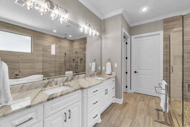 17 Cove Creek Pt, Little Rock, AR 72211 - full bath with a shower stall, double vanity, recessed lighting, ornamental molding, and baseboards