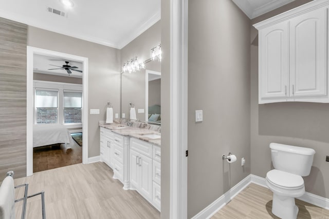 17 Cove Creek Pt, Little Rock, AR 72211 - ensuite bathroom with a ceiling fan, toilet, ornamental molding, wood finished floors, and vanity