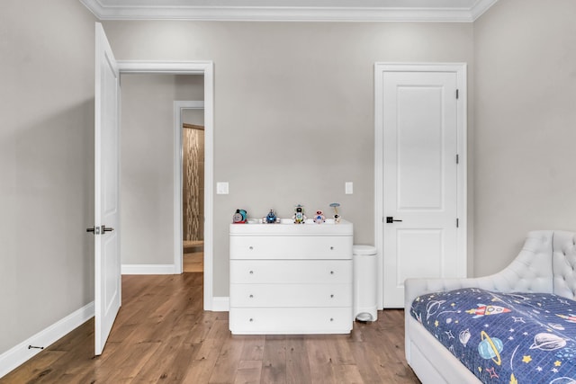 17 Cove Creek Pt, Little Rock, AR 72211 - bedroom with wood finished floors, crown molding, and baseboards
