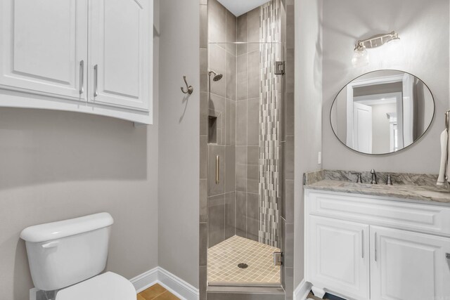 17 Cove Creek Pt, Little Rock, AR 72211 - bathroom with a stall shower, toilet, baseboards, and vanity