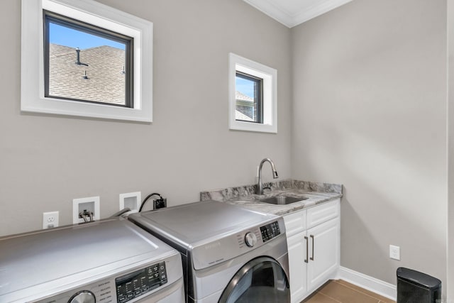 17 Cove Creek Pt, Little Rock, AR 72211 - laundry area with cabinet space, washing machine and dryer, plenty of natural light, crown molding, and baseboards