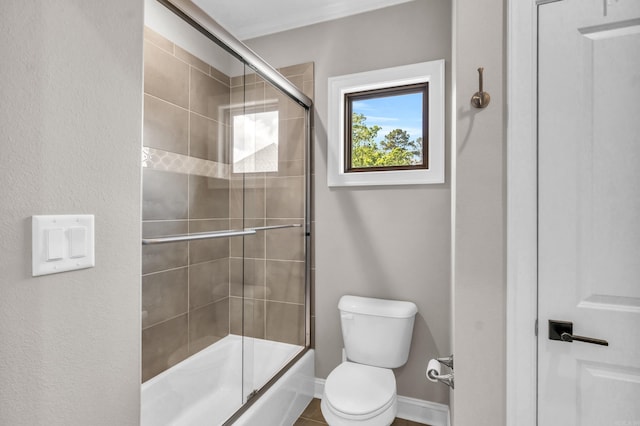 17 Cove Creek Pt, Little Rock, AR 72211 - bathroom featuring toilet and enclosed tub / shower combo