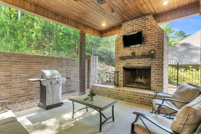 17 Cove Creek Pt, Little Rock, AR 72211 - view of patio with an outdoor brick fireplace, a grill, and fence