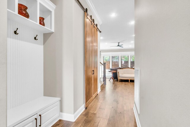 17 Cove Creek Pt, Little Rock, AR 72211 - mudroom with a barn door, light wood-type flooring, baseboards, a ceiling fan, and recessed lighting