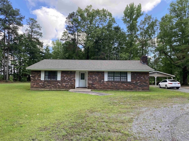 307 Clark Rd, White Hall, AR 71602 - single story home with a chimney, a front yard, brick siding, and a carport