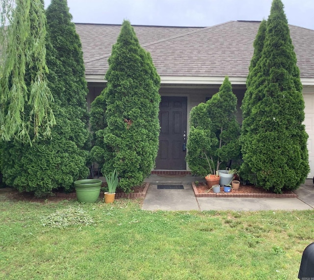 713 Covenant Pl, Searcy, AR 72143 - doorway to property with a shingled roof and a yard