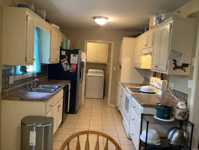 713 Covenant Pl, Searcy, AR 72143 - kitchen featuring washer / dryer, white electric range, a sink, under cabinet range hood, and black dishwasher