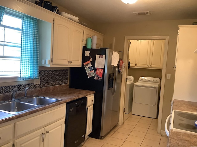 713 Covenant Pl, Searcy, AR 72143 - kitchen featuring dishwasher, washer and clothes dryer, light tile patterned flooring, a sink, and range with electric cooktop