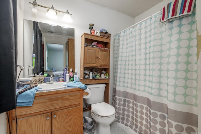 full bathroom featuring toilet, vanity, and a shower with shower curtain