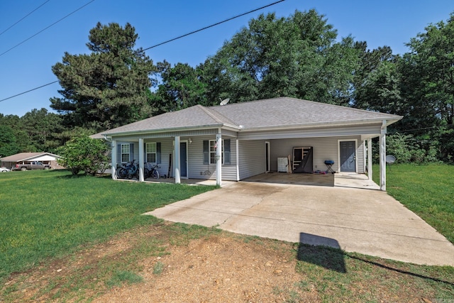 view of front of property with concrete driveway, covered porch, a front lawn, an attached carport, and roof with shingles