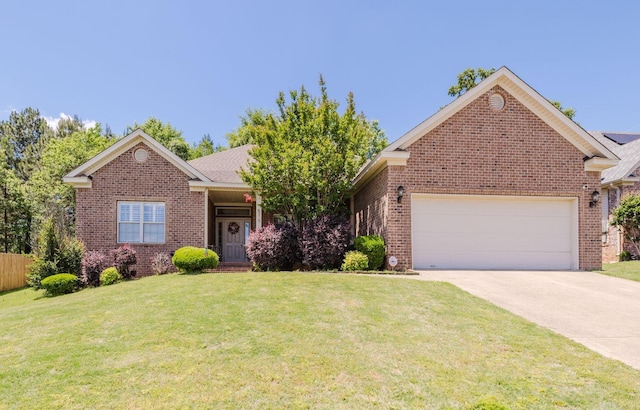 51 Waters Edge Dr, Little Rock, AR 72204 - ranch-style house featuring brick siding, a front yard, an attached garage, and driveway